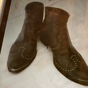 Black leather boots with silver studs and silver toe details